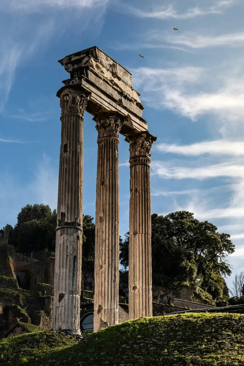 Ancient Doric columns against a clear blue sky