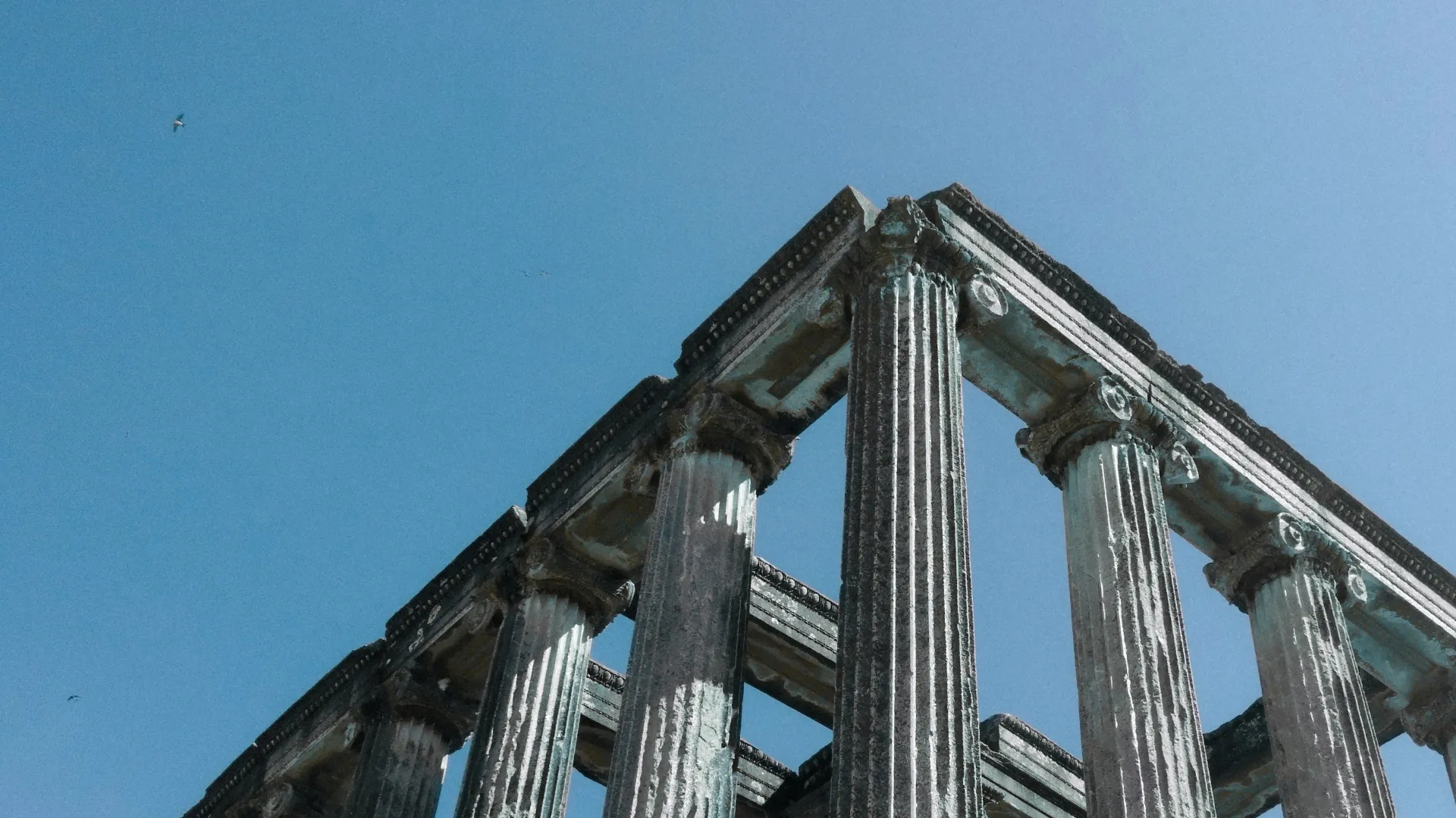 Ancient Roman ruins under a clear blue sky